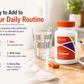 McCord VitalBoost supplement bottle with instructions on a table with water and snacks.
