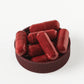 Red capsules in maroon lid