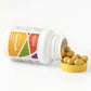 Yellow softgels sitting next to white bottle with yellow cap